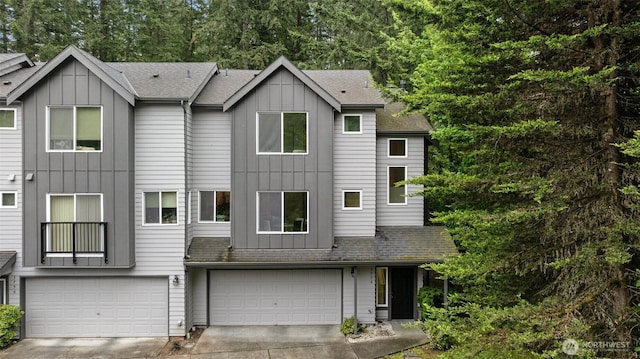 3758 257th Ave SE Unit 4-4, Issaquah, WA 98029 - townhome / multi-family property featuring board and batten siding, an attached garage, concrete driveway, and roof with shingles
