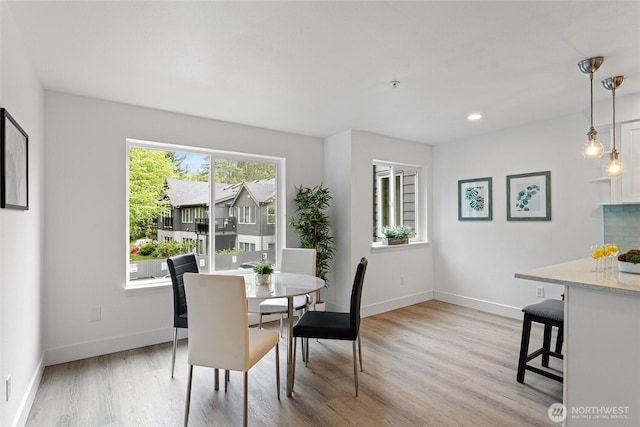 3758 257th Ave SE Unit 4-4, Issaquah, WA 98029 - dining space with light wood-style flooring and baseboards