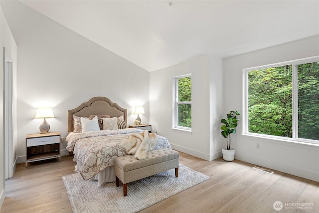 3758 257th Ave SE Unit 4-4, Issaquah, WA 98029 - bedroom featuring light wood-type flooring, baseboards, and lofted ceiling