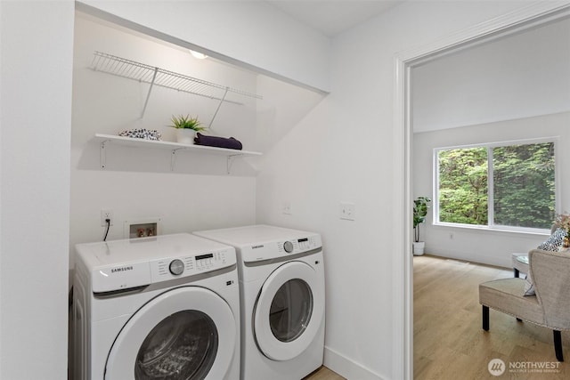 3758 257th Ave SE Unit 4-4, Issaquah, WA 98029 - clothes washing area with independent washer and dryer, light wood-type flooring, and baseboards
