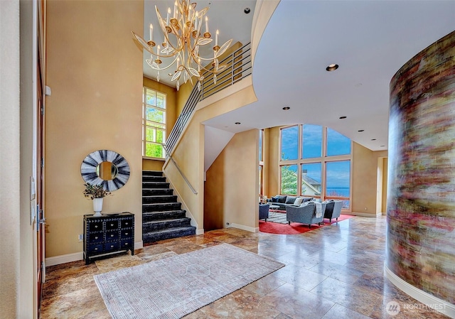 7212 164th St SW, Edmonds, WA 98026 - entryway with stairway, a chandelier, recessed lighting, and stone finish floors