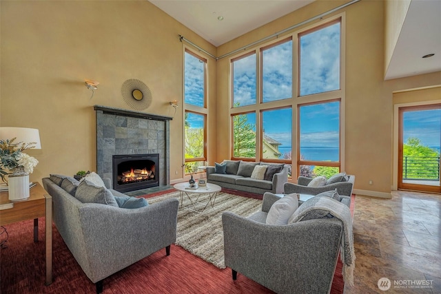 7212 164th St SW, Edmonds, WA 98026 - living room with a towering ceiling, stone tile floors, and a fireplace