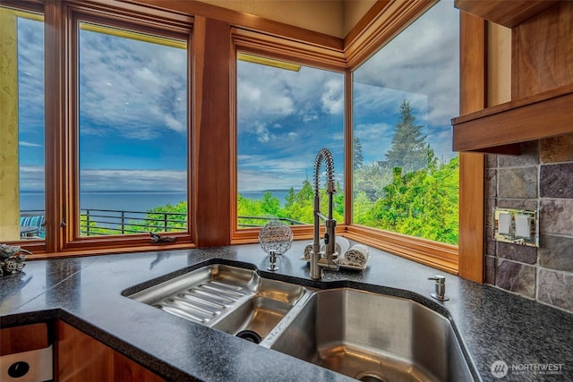 7212 164th St SW, Edmonds, WA 98026 - kitchen view of dark countertops, nearby water, and tasteful backsplash