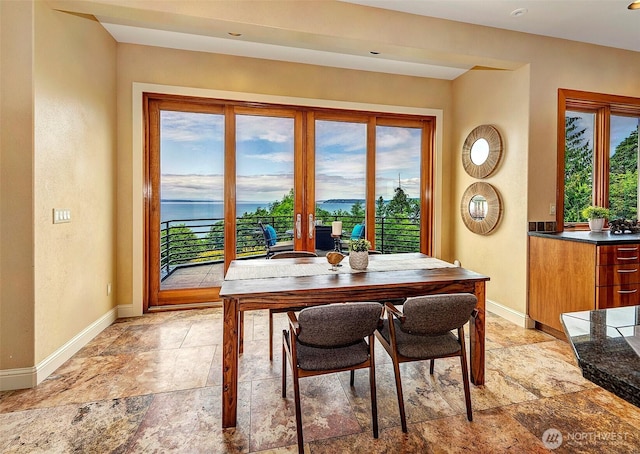 7212 164th St SW, Edmonds, WA 98026 - dining area with baseboards and light stone finish floors