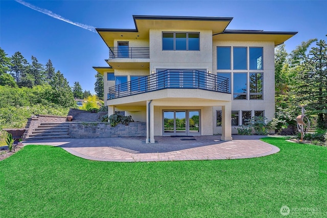 7212 164th St SW, Edmonds, WA 98026 - rear view of house with stucco siding, a balcony, a yard, and a patio