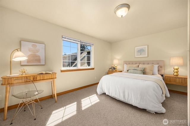 bedroom featuring carpet and baseboards
