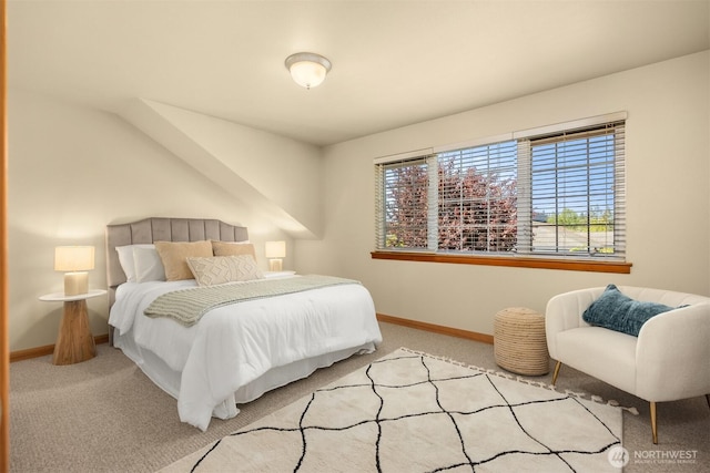 bedroom featuring baseboards and carpet floors