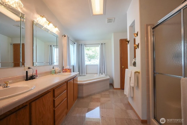 201 S Cherry St, Dayton, WA 99328 - full bathroom with a sink, a shower with shower door, a garden tub, and visible vents