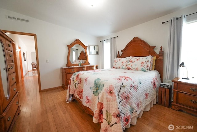 201 S Cherry St, Dayton, WA 99328 - bedroom featuring baseboards, visible vents, and light wood-style floors