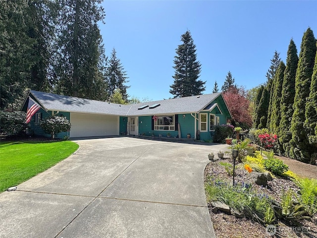 401 Dungeness Mdws, Sequim, WA 98382 - single story home featuring a garage, concrete driveway, and a front lawn