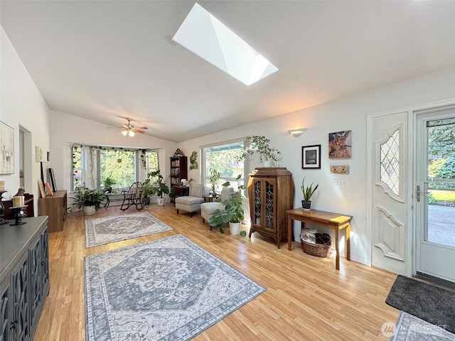 401 Dungeness Mdws, Sequim, WA 98382 - living area with vaulted ceiling, light wood finished floors, and a skylight