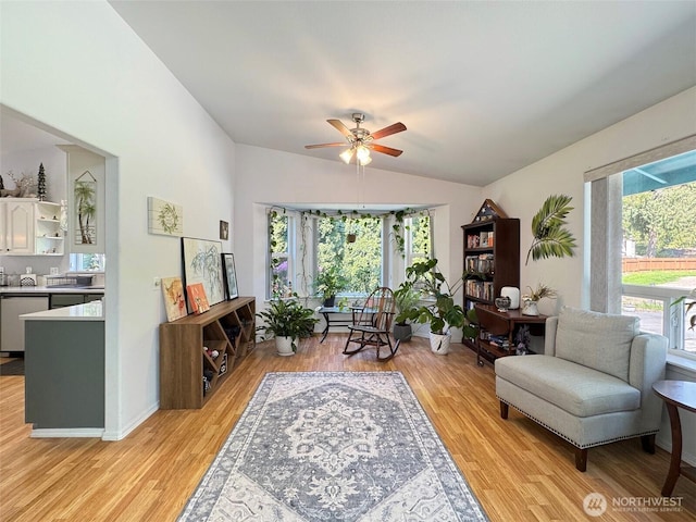 401 Dungeness Mdws, Sequim, WA 98382 - living area featuring vaulted ceiling, light wood finished floors, and a ceiling fan