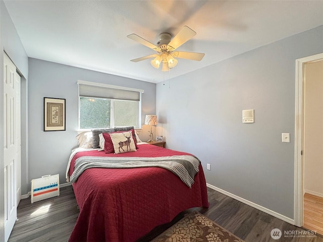 401 Dungeness Mdws, Sequim, WA 98382 - bedroom featuring wood finished floors, baseboards, a closet, and ceiling fan