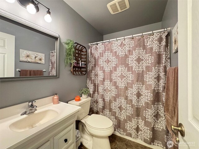 401 Dungeness Mdws, Sequim, WA 98382 - bathroom featuring vanity, toilet, tile patterned floors, and curtained shower