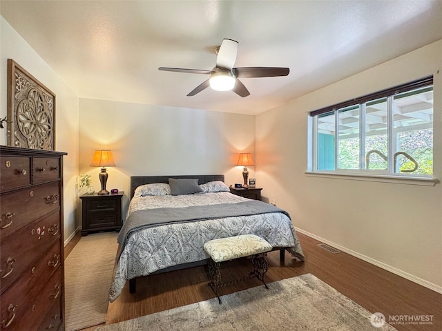 401 Dungeness Mdws, Sequim, WA 98382 - bedroom featuring baseboards, wood finished floors, and a ceiling fan