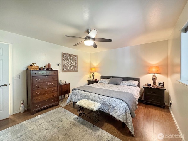 401 Dungeness Mdws, Sequim, WA 98382 - bedroom featuring wood finished floors, ceiling fan, and baseboards