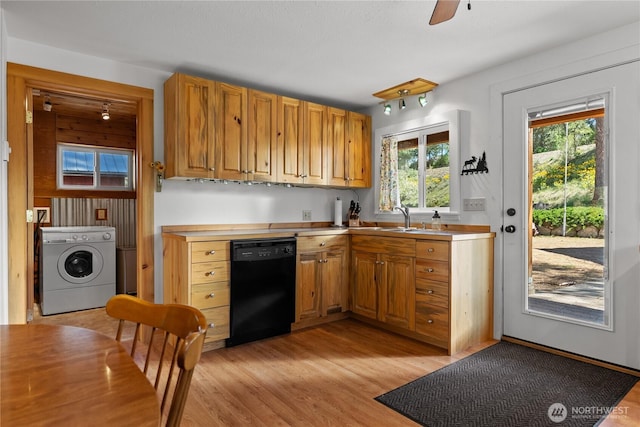 69 Ross Rd, Twisp, WA 98856 - kitchen with washer / clothes dryer, dishwasher, light wood finished floors, and a sink