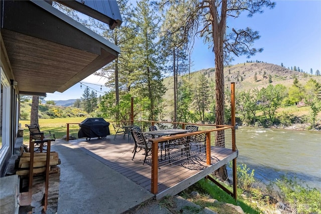 69 Ross Rd, Twisp, WA 98856 - deck featuring outdoor dining area, a grill, and a water and mountain view