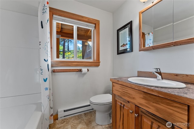 69 Ross Rd, Twisp, WA 98856 - full bath featuring a baseboard radiator, toilet, baseboards, and vanity