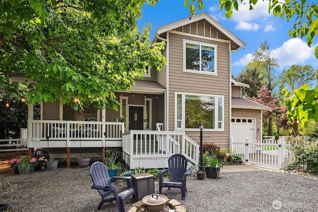 545 SE Lewis St, Issaquah, WA 98027 - craftsman-style house with a porch, an attached garage, fence, and a gate