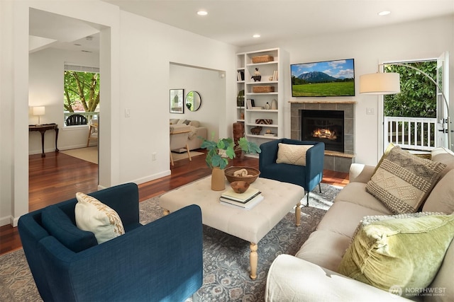 545 SE Lewis St, Issaquah, WA 98027 - living area featuring recessed lighting, a tile fireplace, baseboards, and wood finished floors