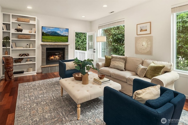 545 SE Lewis St, Issaquah, WA 98027 - living room with a tiled fireplace, visible vents, wood finished floors, and recessed lighting