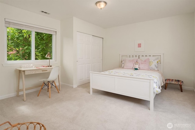 545 SE Lewis St, Issaquah, WA 98027 - bedroom with baseboards, light carpet, and visible vents