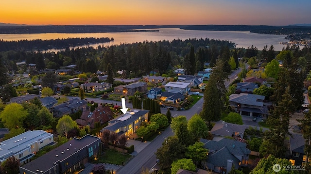 aerial view at dusk of a residential view and a water view