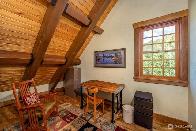 living area with lofted ceiling with beams, wood ceiling, and wood finished floors