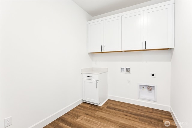20336 150th St E Unit 588, Bonney Lake, WA 98391 - laundry room featuring electric dryer hookup, washer hookup, wood finished floors, baseboards, and cabinet space