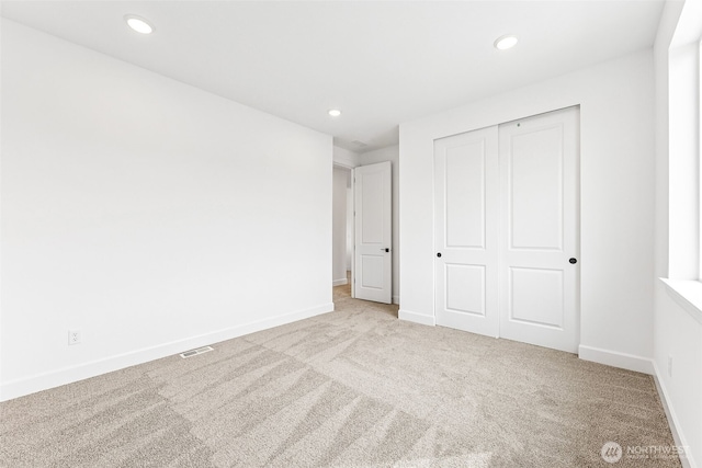 20336 150th St E Unit 588, Bonney Lake, WA 98391 - unfurnished bedroom featuring carpet, baseboards, recessed lighting, and a closet