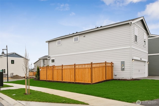 14825 203rd Avenue Ct E Unit 646, Bonney Lake, WA 98391 - exterior space with fence, a yard, driveway, and a garage
