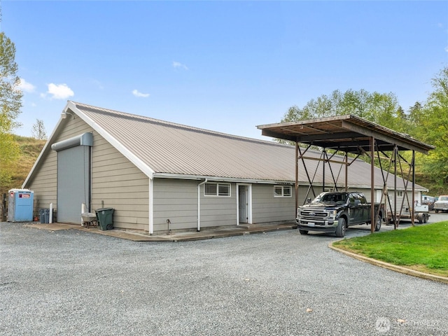 21608 186th Ave E, Orting, WA 98360 - view of parking / parking lot featuring asphalt driveway and a detached carport
