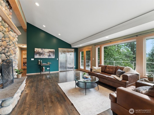 21608 186th Ave E, Orting, WA 98360 - living area with wood finished floors, recessed lighting, a stone fireplace, high vaulted ceiling, and beam ceiling