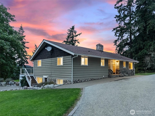 21608 186th Ave E, Orting, WA 98360 - ranch-style house with a chimney, stairs, and a lawn