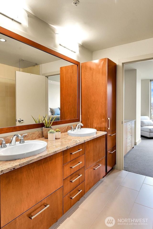 2121 Terry Ave Unit N1203, Seattle, WA 98121 - ensuite bathroom featuring double vanity and tile patterned floors