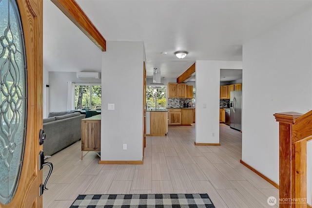 4716 167th Ave NW, Lakebay, WA 98349 - foyer featuring a wall mounted AC, healthy amount of natural light, baseboards, and beam ceiling