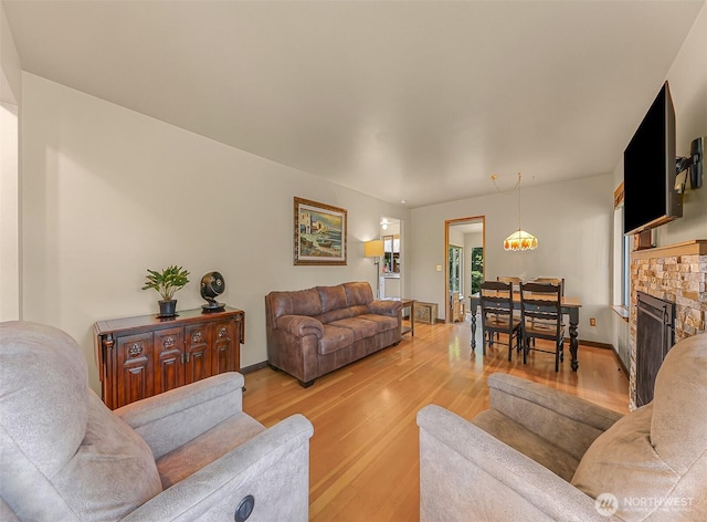 832 Elm Ave, Blaine, WA 98230 - living area featuring light wood-style flooring, a fireplace, and baseboards