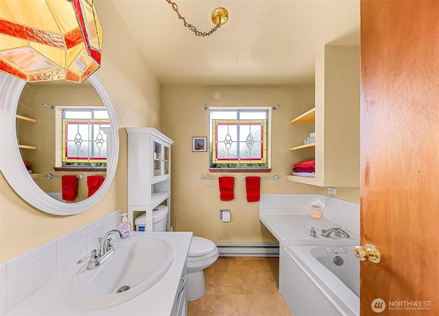 832 Elm Ave, Blaine, WA 98230 - full bathroom featuring baseboard heating, healthy amount of natural light, vanity, and a bath