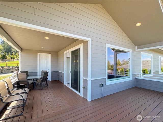 wooden terrace featuring outdoor dining space