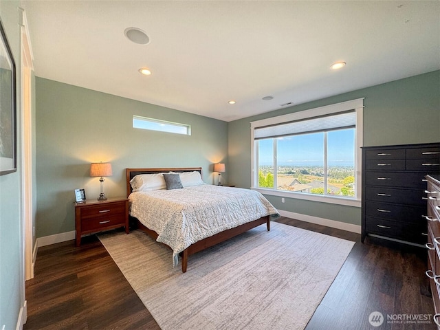 bedroom featuring baseboards, recessed lighting, and dark wood-type flooring