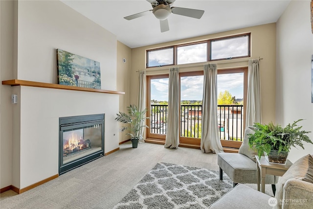210 W Pioneer Unit 316, Puyallup, WA 98371 - sitting room with carpet, ceiling fan, a glass covered fireplace, and baseboards