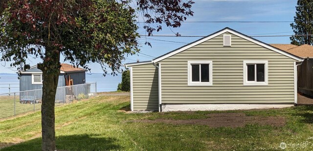 1225 W 5th St, Port Angeles, WA 98363 - view of property exterior featuring a yard and fence