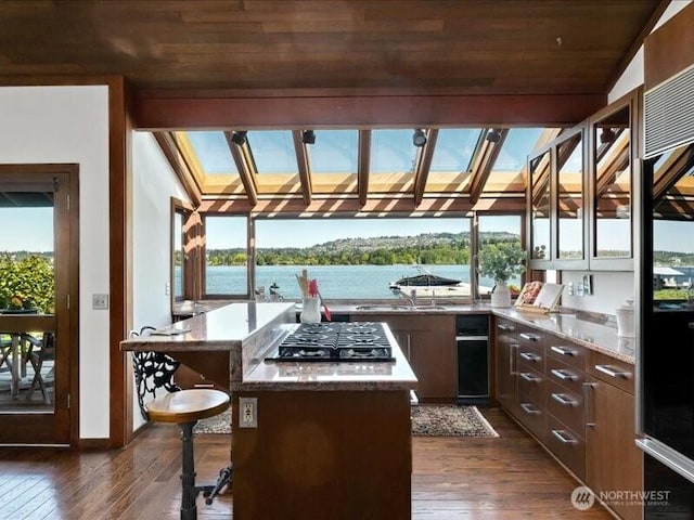 4400 E Mercer Way, Mercer Island, WA 98040 - view of patio / terrace featuring an outdoor kitchen and a water view