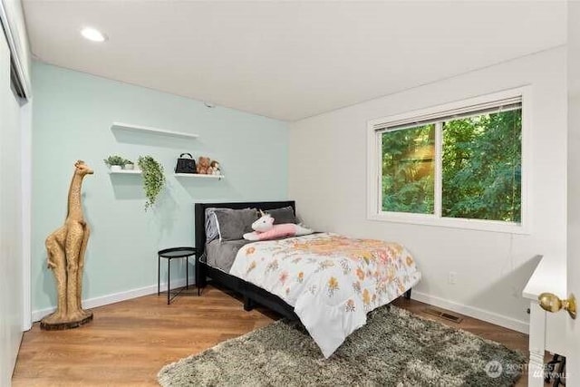 7236 Twin Cedar Ln SE, Tumwater, WA 98501 - bedroom with baseboards, wood finished floors, and recessed lighting