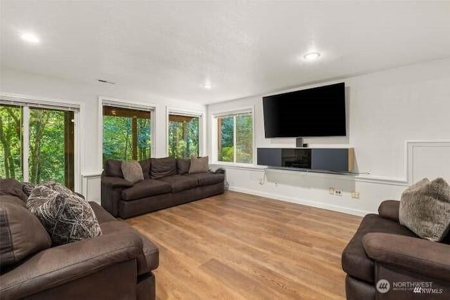 7236 Twin Cedar Ln SE, Tumwater, WA 98501 - living room featuring plenty of natural light, wood finished floors, recessed lighting, and baseboards