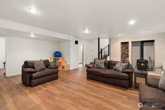 7236 Twin Cedar Ln SE, Tumwater, WA 98501 - living area with wood finished floors, stairs, a wood stove, and recessed lighting