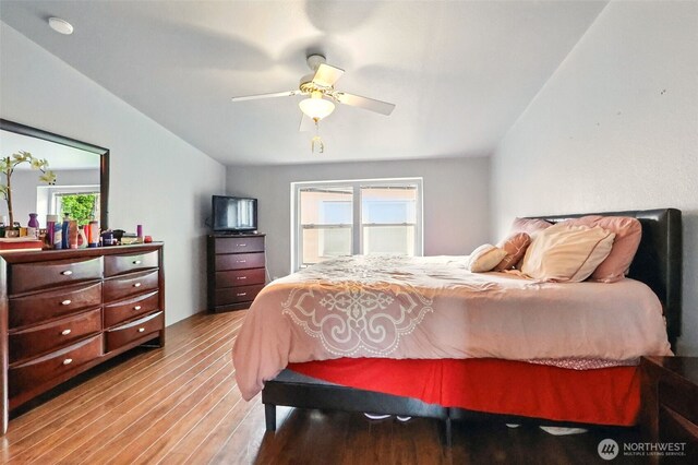 bedroom with wood finished floors and a ceiling fan