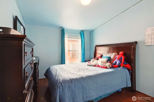 bedroom featuring dark wood-type flooring