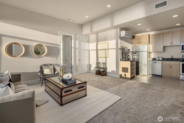 living area featuring recessed lighting, visible vents, baseboards, and light carpet